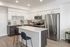 Modern kitchen with stainless steel appliances at The Edison luxury apartments in Reno, NV