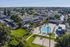Aerial view of The Phoenix Apartments community and resort-style pool in Sacramento, California
