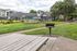 Picnic tables and bbqs at Stadium Park Apartment Community in Eugene, Oregon