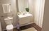 Bright bathroom featuring a sleek vanity, indoor plant, and modern fixtures located at Centennial Ridge apartments.