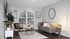 Elegant living room with stylish furnishings, featuring a grey sofa, a round coffee table, and modern decor within Centennial Village apartment.