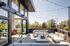 Apartment balcony with modern outdoor seating and scenic views at The Flats at Chase in Eugene, OR