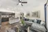 Model Living Room and Kitchen at Stone Hill Apartment Community in Pflugerville, Texas