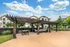 Outdoor Trellis Lounge Area at Stone Hill Apartment Community in Pflugerville, Texas