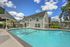 Resort-style outdoor swimming pool in the Mansion area at Chase Village apartments Eugene OR