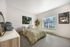 Guest bedroom in model apartment with spacious layout at Chase Village Eugene OR