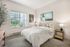 Primary bedroom in model apartment with vaulted ceilings at Chase Village Eugene OR