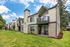 Second residential building exterior view with greenery at Chase Village Eugene OR