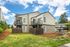Third residential building exterior showing community grounds at Chase Village Eugene OR