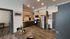 Modern kitchen with wood cabinetry and stainless steel appliances at The Flats at Chase in Eugene, OR