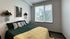 Bright modern bedroom with natural light at The Flats at Chase student apartments in Eugene, OR