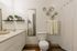 Stylish bathroom with plants and polished fixtures at Stadium Park in Eugene OR