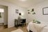 Furnished private bedroom with modern desk and cozy decor at Stadium Park in Eugene OR