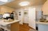 Modern kitchen with stainless appliances and in-unit washer dryer at Stadium Park in Eugene OR