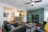 Open-concept living area with kitchen island at Stadium Park student apartments in Eugene OR