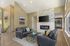 Canyon Springs clubhouse fireside lounge with leather sofas wood accent wall and cozy fireplace in Lynnwood WA