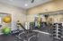 Canyon Springs fully equipped fitness center with weights exercise balls and mirrored walls in Lynnwood WA