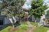 Canyon Springs apartment exterior with manicured landscaping vibrant trees and welcoming pathway in Lynnwood Washington