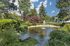 Canyon Springs tranquil garden with charming fountain and lush greenery throughout the Lynnwood WA apartment community