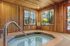 Canyon Springs indoor jacuzzi spa room with warm wooden walls and large windows in Lynnwood WA apartment community