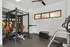 303 Flats modern fitness center featuring weight training area and cardio machines in Knoxville TN