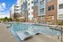 303 Flats outdoor pool with umbrella-shaded lounge chairs for relaxing in Knoxville TN