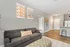 303 Flats bright and spacious model living room with large windows and natural light in Knoxville Tennessee