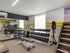 Republic on Main fitness center featuring sleek gym equipment, including treadmills, free weights, and a functional training area, ideal for a healthy lifestyle.