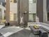 Republic on Main outdoor patio with a cozy gas fire pit, stylish sectional seating, and sleek building facade in Moscow, ID