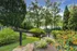 Beautifully landscaped outdoor green space with walking paths at The Landings riverside living Knoxville TN