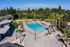 Resort-style pool and lounge deck at The Phoenix Apartments in Sacramento, California