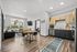Modern open-concept living space with sleek kitchen, cozy dining area, and bright living room featuring stylish decor and natural light.