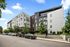 Modern apartment building with sleek design, abundant natural light, and lush greenery at Flats @ Chase.