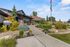 Inviting leasing office entrance with lush landscaping and modern architecture.