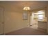 Marcell Gardens Apartments, interior, open concept living room/kitchen, white cabinets, carpet, tile