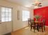 La Aloma Apartments, interior, front door, dining table, red accent wall, ceiling fan