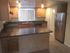 Marcell Gardens Apartments, interior, kitchen, peninsula counter, stainless steel appliances, window,