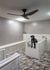 Rendering of a pet washing room with two large tubs, detachable sprayers, dryers with hoses and a hand-washing sink.
