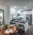 Chef-inspired kitchens with premium appliance packages, spacious islands, and built-in pantries