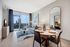 Stunning engineered hardwood flooring and floor-to-ceiling windows