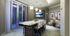 A dining space with an 8-person dining table, a seating area with armchairs, and a wall-mounted HDTV