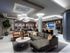 Billiards lounge with seating area and a wet bar with stainless steel kitchen appliances.