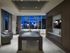 Room with billiards table, large windows, an HDTV, 4 armchairs, and stone floors
