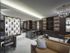 Resident lounge with leather couches, black marble desks, white marble floors, a geometric white room divider, and a wood-paneled wall of wine bottles stored behind gold grates.