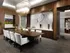 Dining room with 8-person wooden table, modern glass chandelier, HDTV, modern art, and wood-paneled walls with geometric mosaic insets.