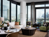 Living room with floor-to-ceiling window walls with a city view, a door to the balcony and a white pillar in the corner. There is a white marble dining table with chairs, a white couch and green and brown chairs seated at a large wooden coffee table.