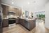 kitchen with cream granite counters, light brown cabinets and stainless steel appliances