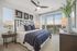 bedroom with floor to ceiling windows and king-size bed