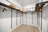walk in closet with shelving and hanging racks