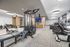 fitness center with weight machines, exercise bikes and treadmills